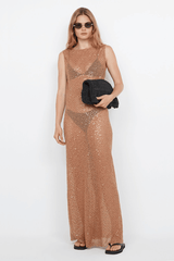 Margot Maxi Dress Camel by Bec + Bridge – A glamorous sequin-covered maxi with a boat neckline, sheer overlay, and raw hem, perfect for chic evening events.