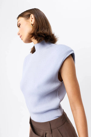 Quiet Force Top by Mossman in sky blue, ribbed sleeveless turtleneck with removable shoulder pads for sleek everyday styling.
