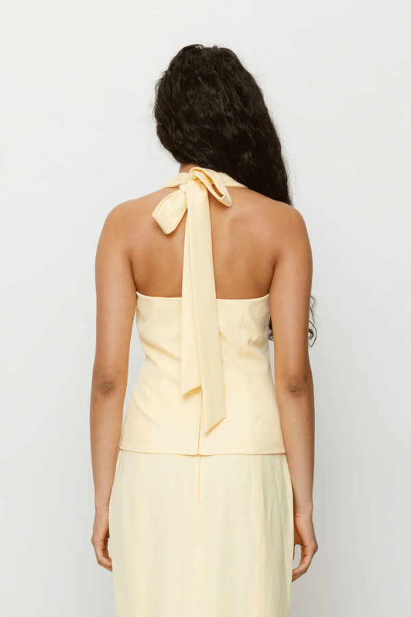 Inka Vest Top Aqua by The Wolf Gang, a halter crop with custom hardware and asymmetric closure. Perfect for sets or sleek solo styling.