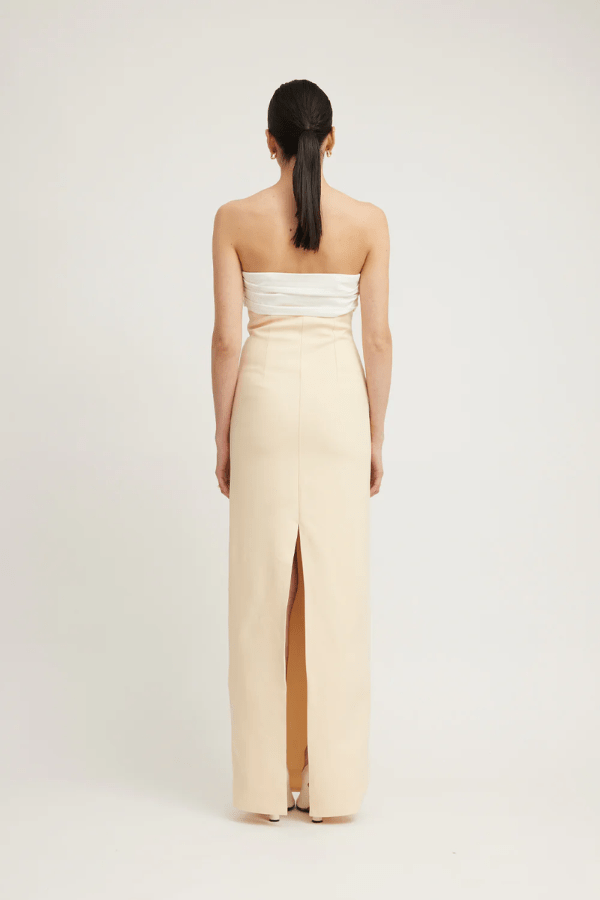 Kasai Dress Lemon/Ivory by Tojhà – A chic strapless maxi with structured bonded fabric, signature buckle detail, and princess seams, perfect for sophisticated events.