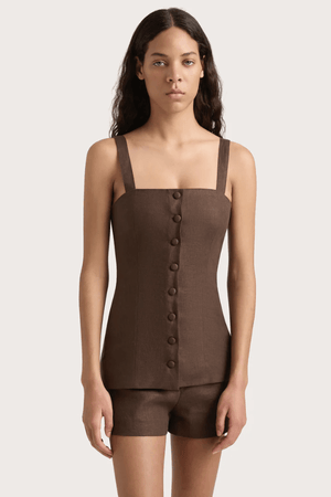 Corbiere Vest Bistre by Faithfull the Brand, sophisticated 100% European Flax® linen vest with wide straps, straight neckline, and mock buttons, perfect for trendy viral layering and elegant summer looks.