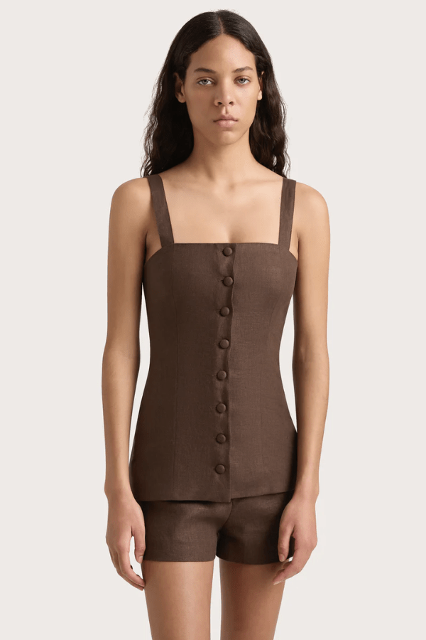 Corbiere Vest Bistre by Faithfull the Brand, sophisticated 100% European Flax® linen vest with wide straps, straight neckline, and mock buttons, perfect for trendy viral layering and elegant summer looks.