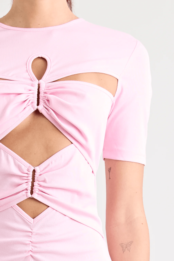 Florence Dress Pink by Pfeiffer – A trendy fitted maxi with cut-out hardware accents, crafted from soft cotton-spandex. Perfect for chic, ethical day-to-night wear. Made in Australia with care.