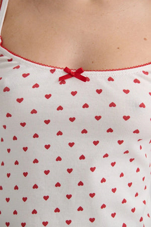 Hugo Singlet by KATH The Label, soft ribbed cotton with red heart print and bows. Perfect for lounging, layering, or sleepwear.