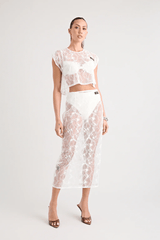 Astrid Lace Top White by Pfeiffer, dreamy lace with keyhole back and relaxed fit, perfect for trendy viral layering over bras or bikinis and chic day-to-night styles.