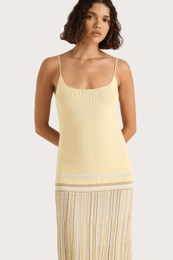 Citara Maxi Dress Butter Stripe by Faithfull the Brand – Trendy ribbed knit maxi with adjustable straps and backless tie, perfect for effortless summer elegance and beach days.