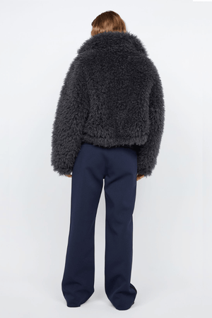 Argo Jacket Charcoal by Bec + Bridge – A chic charcoal faux fur bomber with wide collar, relaxed fit, front hook closure, and low waist finish. Fully lined. Dry clean only.