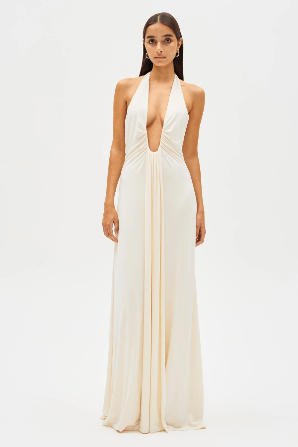 Jennifer Cupro Maxi Dress Ivory by Misha – A sleek and sophisticated maxi with a plunging halter neckline and dramatic sash, perfect for elegant day-to-night events.