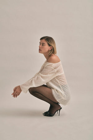 The Eloise Beaded Mini Ivory by Solaqua – sheer beaded mini dress with off shoulder neckline and oversized fit.