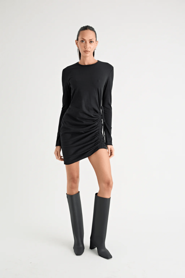 Rule Eight Dress Black by Pfeiffer – A trendy and versatile cotton mini dress with adjustable side ruching, crew neckline, and full sleeves. Perfect for stylish day-to-night wear.