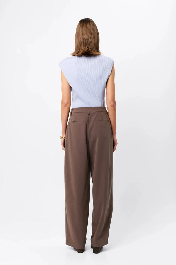 Quiet Force Top by Mossman in sky blue, ribbed sleeveless turtleneck with removable shoulder pads for sleek everyday styling.
