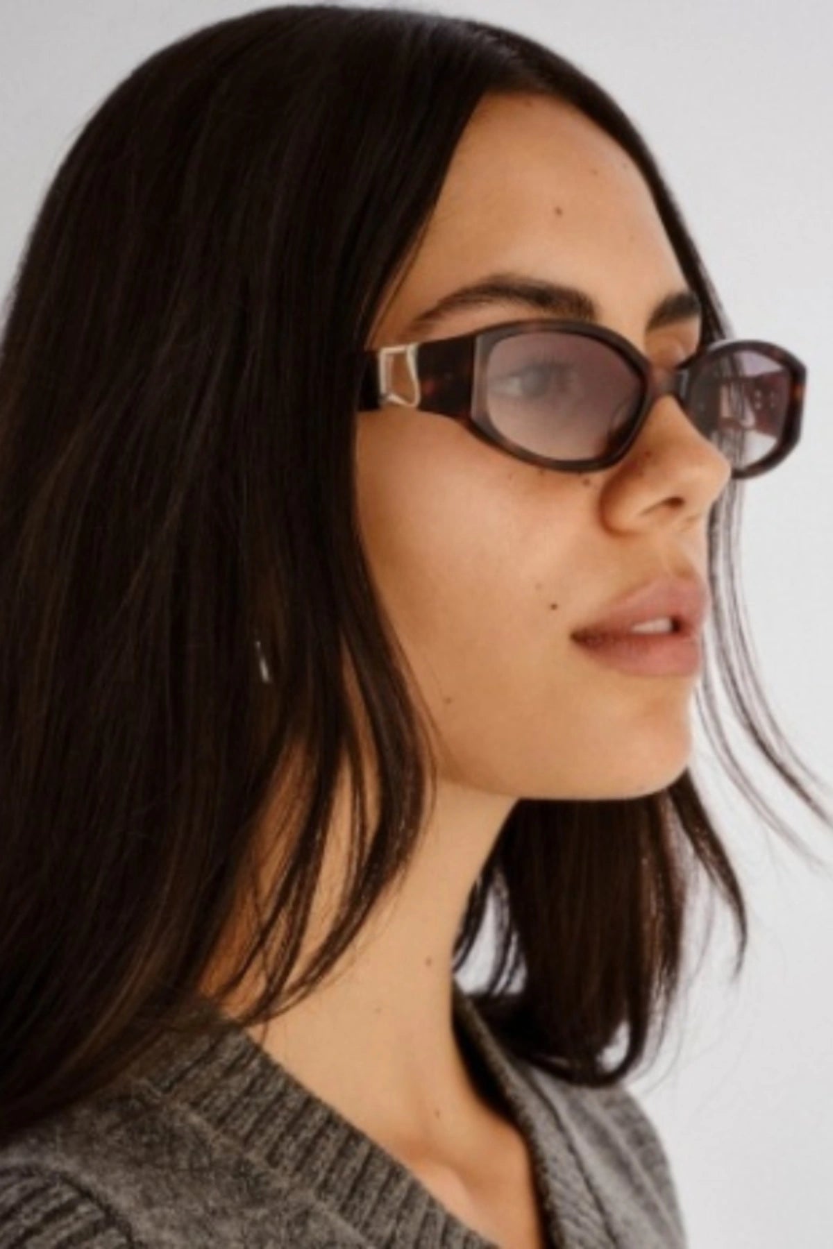 Lottie in Tortoise by Luv Lou, luxe rectangle sunglasses with sculpted angles, gold hardware, and charcoal gradient CR39 lenses.