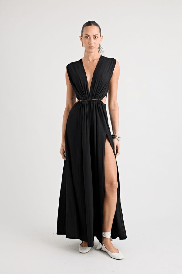 Do For Love Gown Black by Pfeiffer – A trendy, elegant low-plunge maxi with bold hardware and thigh-high split, perfect for special occasions and modern sophistication.