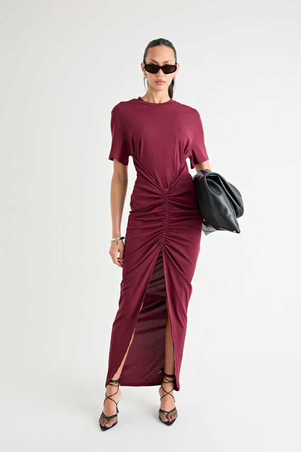 Niko Maxi Dress Burgundy by Pfeiffer – Trendy relaxed T-shirt maxi with adjustable side ruching, crew neck, and breathable cotton blend, perfect for elevated off-duty style and everyday comfort.
