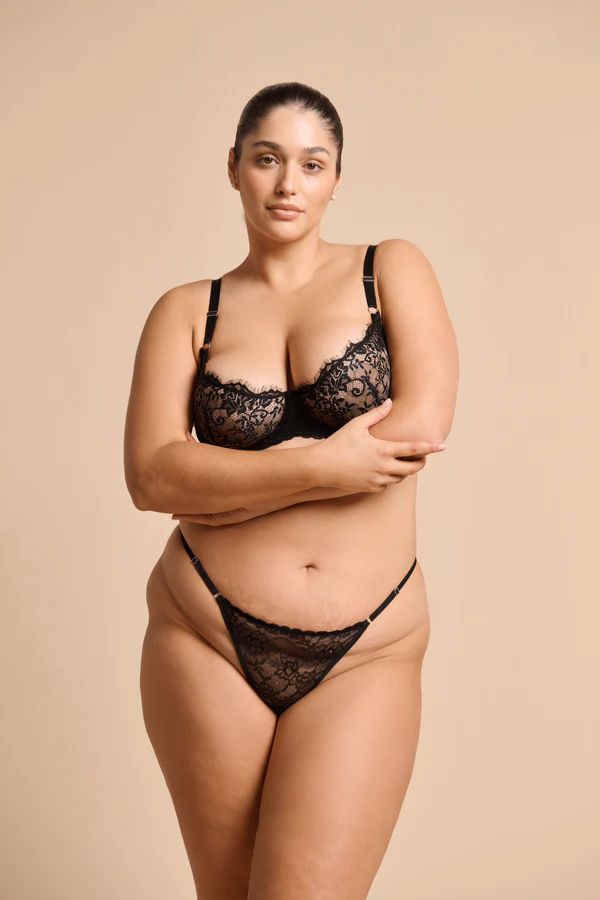Rosie Thong in Black by Kat the Label, high-cut lace thong with a soft mesh back and adjustable waistband, perfect for comfort and a touch of luxe elegance.