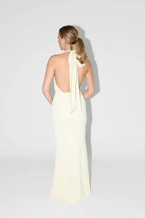 The Ultimate Muse Tie Neck Maxi Dress Butter Cream by Odd Muse – A viral bridal favorite featuring a flattering V-neck, draped shoulders, and elegant low back, perfect for all-night celebrations.