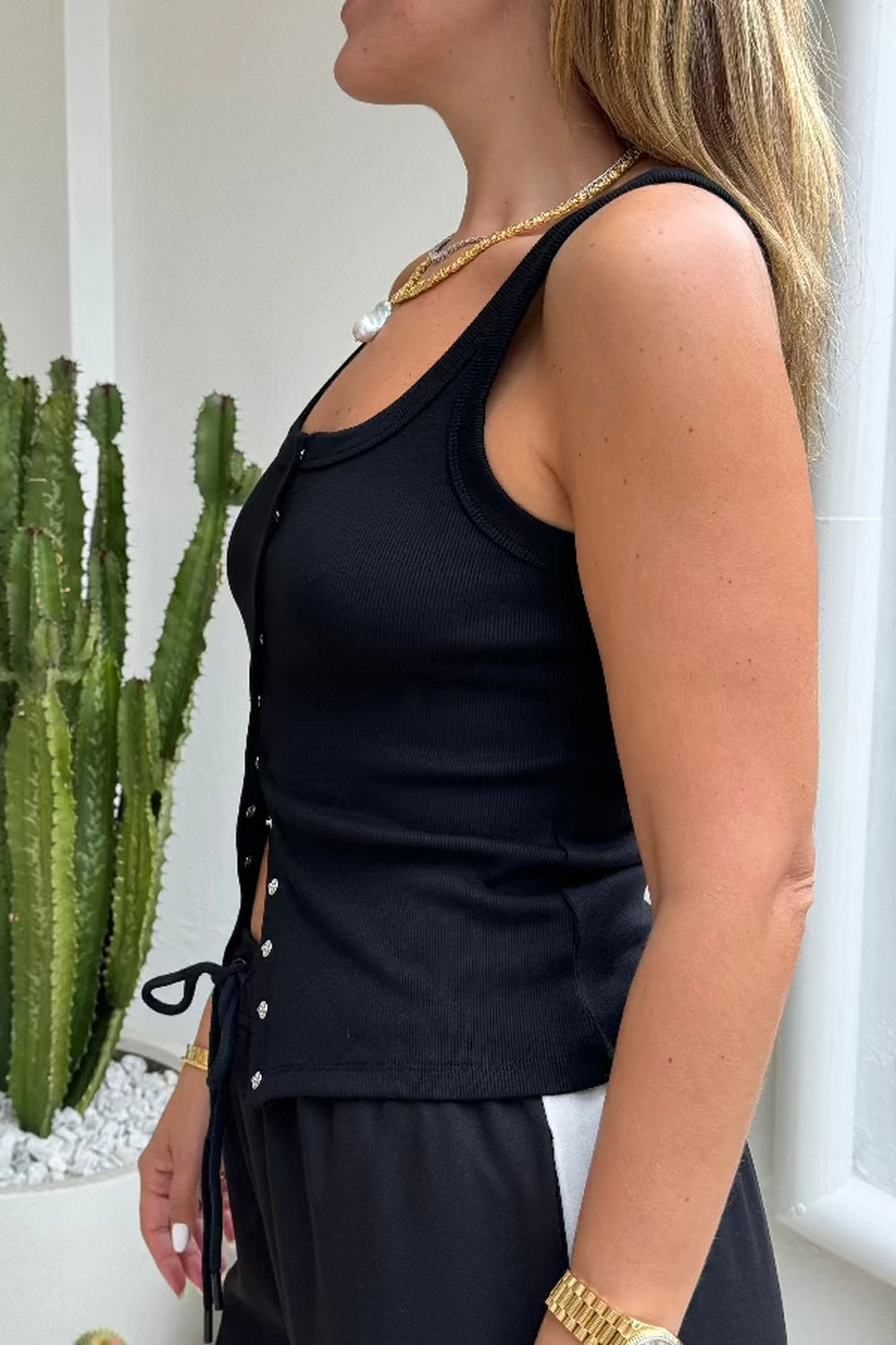 Frankie Scoop Tank White by Sneaky Link – A trendy, versatile cotton blend tank with a chic snap button front and flattering scoop neckline. Perfect for casual summer days or dressed-up looks.