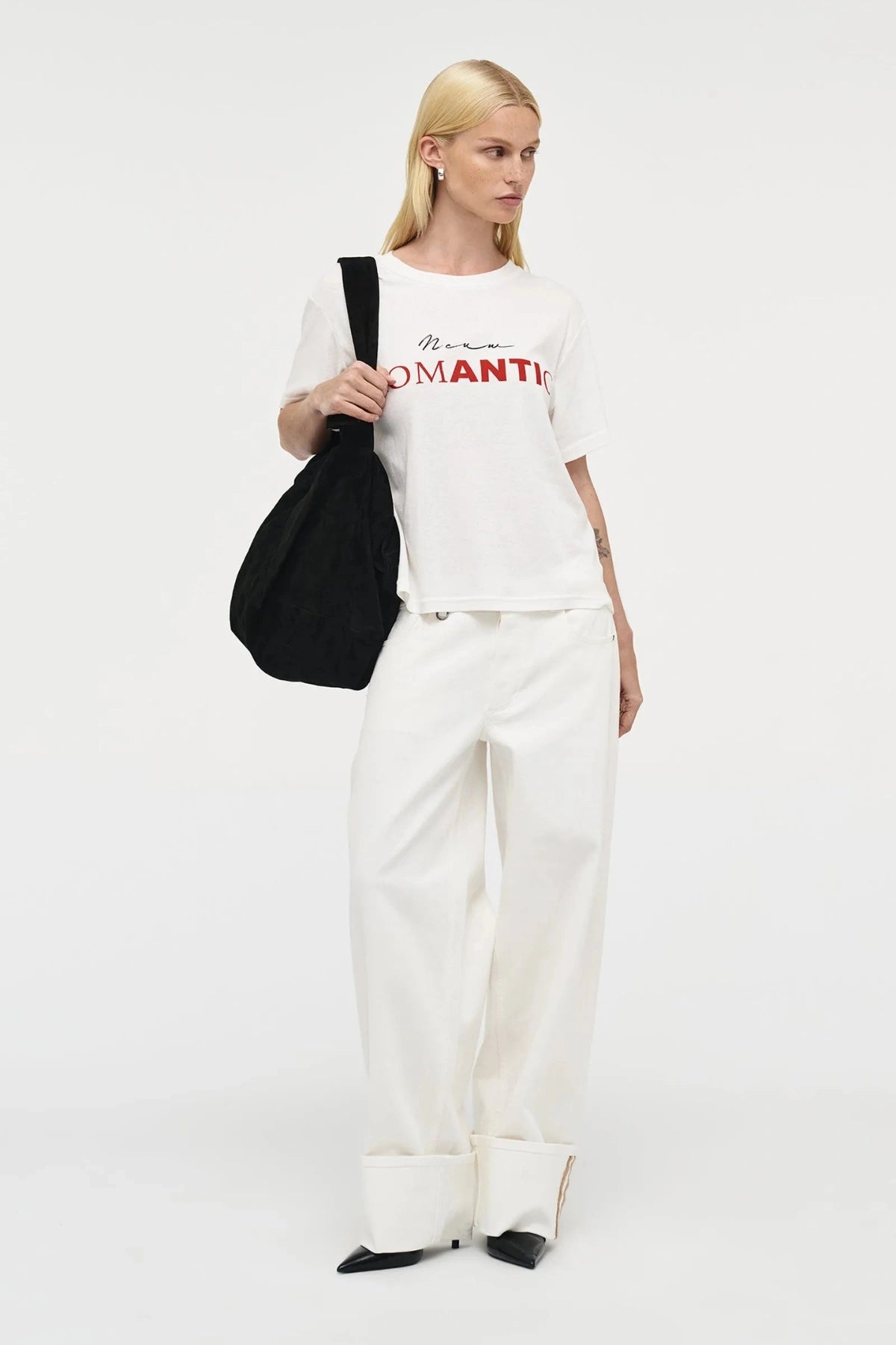 Nancy Barrel – White by Neuw Denim, mid-rise barrel leg jeans with cuffed hem and stretch comfort. Perfect for modern denim styling.