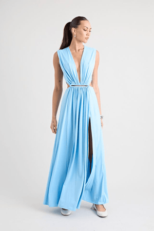 Do For Love Gown Light Blue by Pfeiffer – A trendy, elegant maxi with a deep plunge, thigh-high split, and bold hardware, perfect for special occasions and evening events.