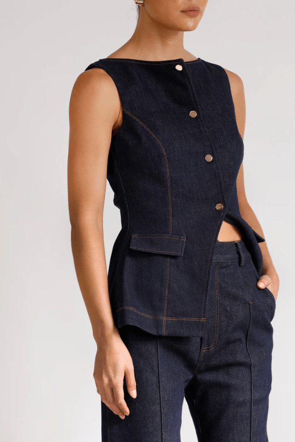 Good Vibes Top Indigo by Pasduchas – Trendy stretch denim with structured fit, gold snap studs, and mock pockets; perfect for chic, coordinated looks.