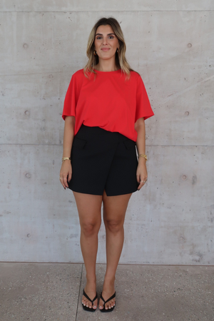 Sneaky Mini Skirt Black by Sneaky Link – A-line high-waisted mini with boned waist and flap pockets, perfect for day-to-night styling.