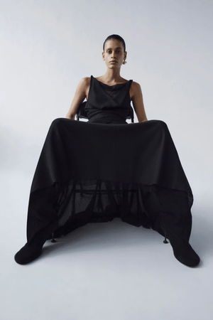 Attar Top Black by Camilla and Marc – draped cowl neck with twisted straps and deep V-back, perfect for elegant dinners or chic evening events.