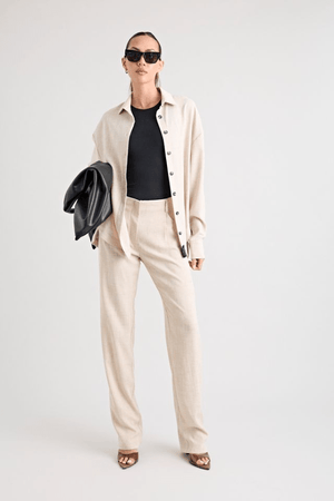 Pino Trouser natural by Pfeiffer, mid-rise tailored pants with front pleats and side pockets, perfect for day-to-night wear and office to evening events.