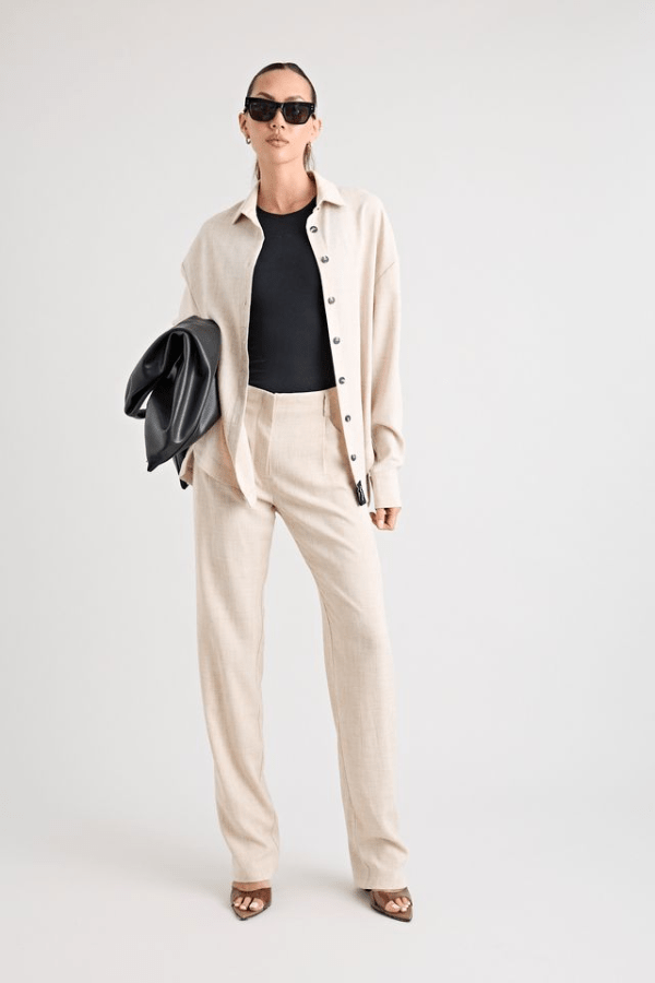 Pino Trouser natural by Pfeiffer, mid-rise tailored pants with front pleats and side pockets, perfect for day-to-night wear and office to evening events.