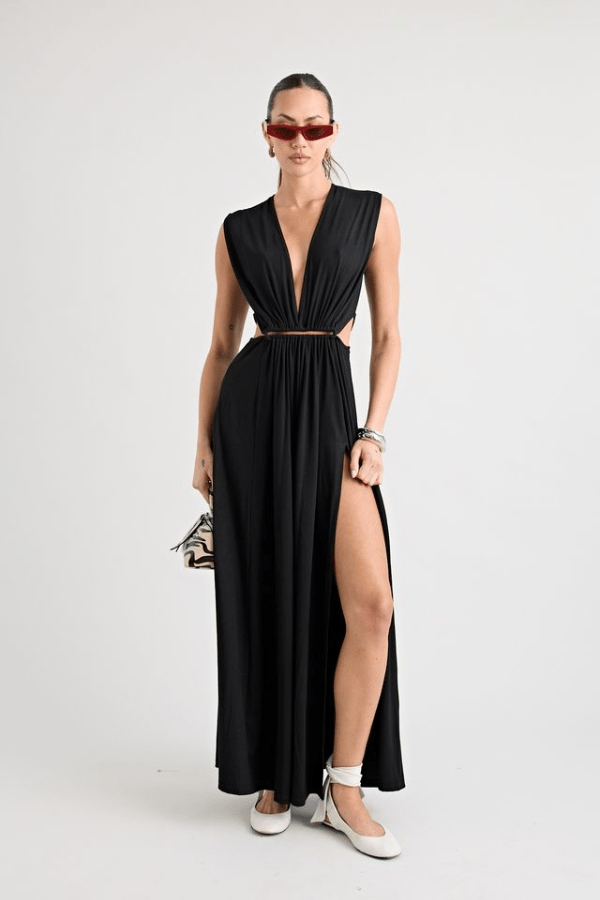 Do For Love Gown Black by Pfeiffer – A trendy, elegant low-plunge maxi with bold hardware and thigh-high split, perfect for special occasions and modern sophistication.