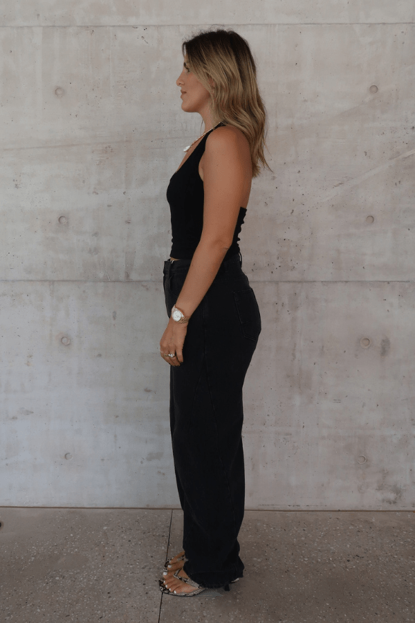 Bella Halter Tank Black by Sneaky Link – A chic, breathable cotton-spandex tank with a deep scoop neckline and open back, perfect for layering or solo wear.