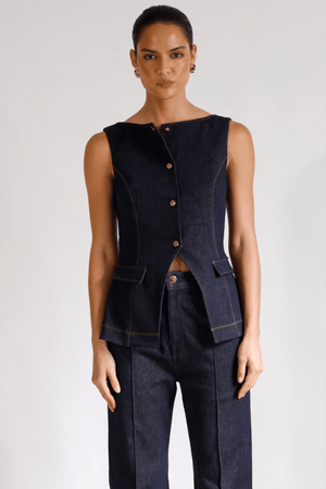 Good Vibes Top Indigo by Pasduchas – Trendy stretch denim with structured fit, gold snap studs, and mock pockets; perfect for chic, coordinated looks.