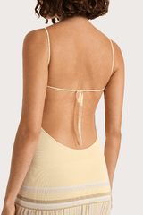 Citara Maxi Dress Butter Stripe by Faithfull the Brand – Trendy ribbed knit maxi with adjustable straps and backless tie, perfect for effortless summer elegance and beach days.