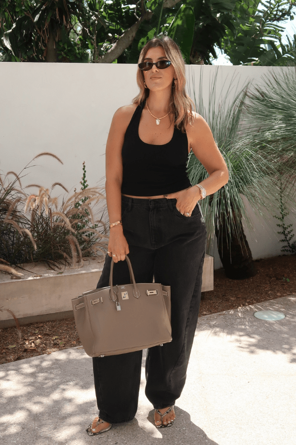 Bella Halter Tank Black by Sneaky Link – A chic, breathable cotton-spandex tank with a deep scoop neckline and open back, perfect for layering or solo wear.