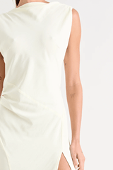Matia Gown Butter by Pfeiffer – A timeless maxi with a boat neckline, low back, and adjustable strap. Perfect for elegant events and special occasions.