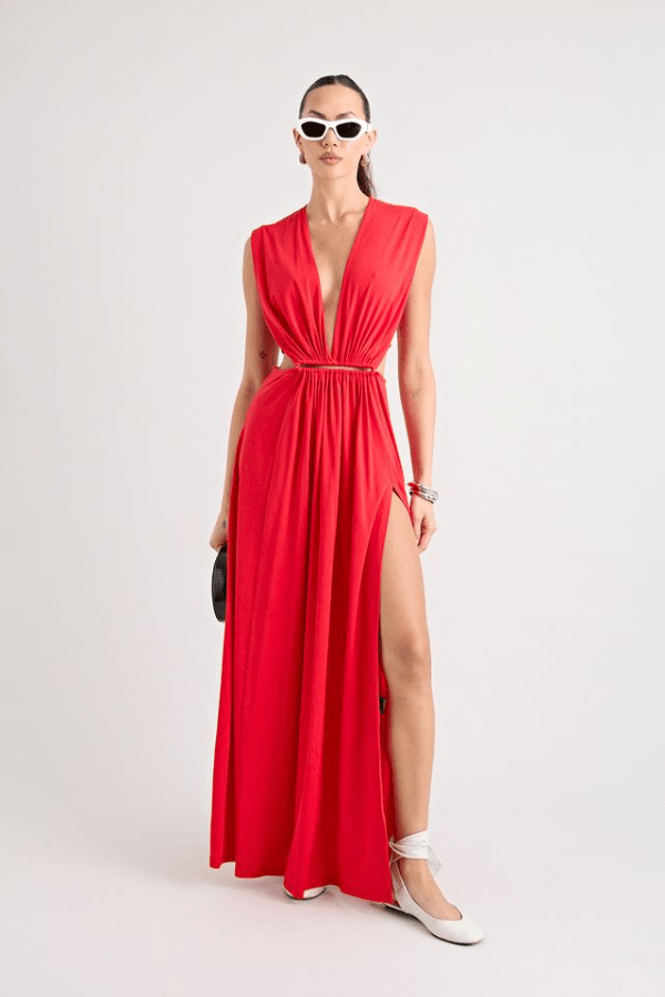 Do For Love Gown Red by Pfeiffer – A trendy low plunge maxi gown with bold hardware and thigh-high split, perfect for turning heads at special occasions.