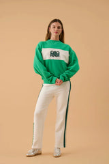 A James Sweatshirt Tropical Green by Araminta James, cotton fleece sweater with contrast panel and relaxed fit, a trendy piece perfect for everyday comfort.
