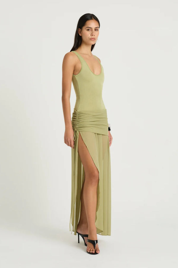 Addison Maxi Dress Pistachio by Benni, sheer scoop-neck maxi with plunge back and ruched tie mini skirt underlay, a chic trendy look for summer events.
