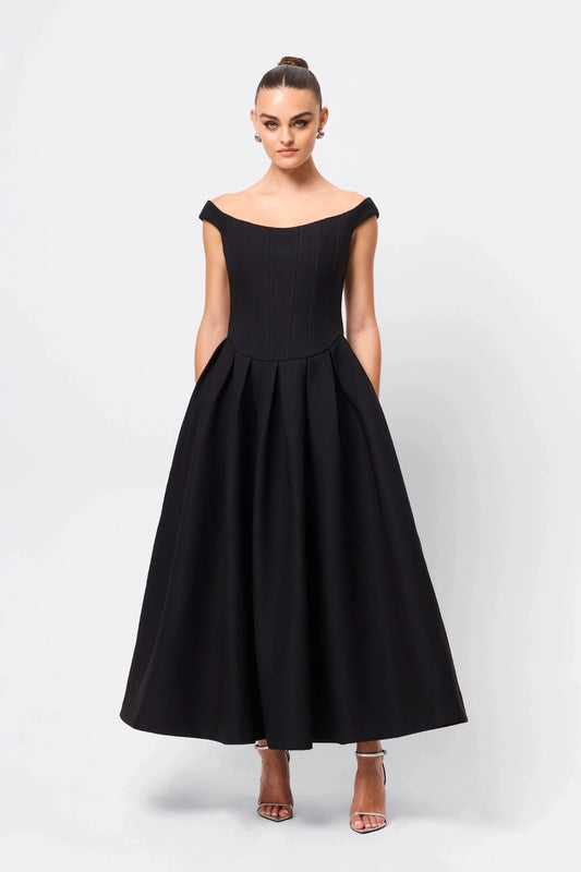 Adoration Maxi Dress Black by Mossman, off-shoulder corset maxi with pleated A-line skirt and pockets, a trendy piece perfect for formal events or evenings.
