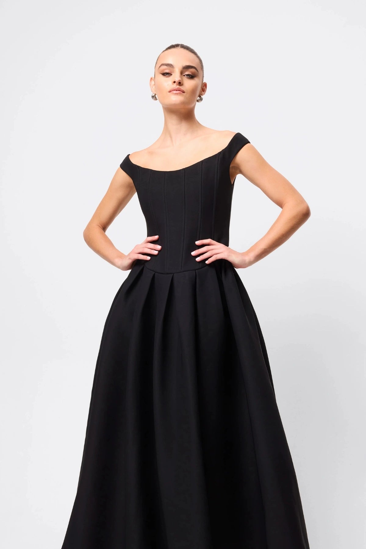 Adoration Maxi Dress Black by Mossman, off-shoulder corset maxi with pleated A-line skirt and pockets, a trendy piece perfect for formal events or evenings.