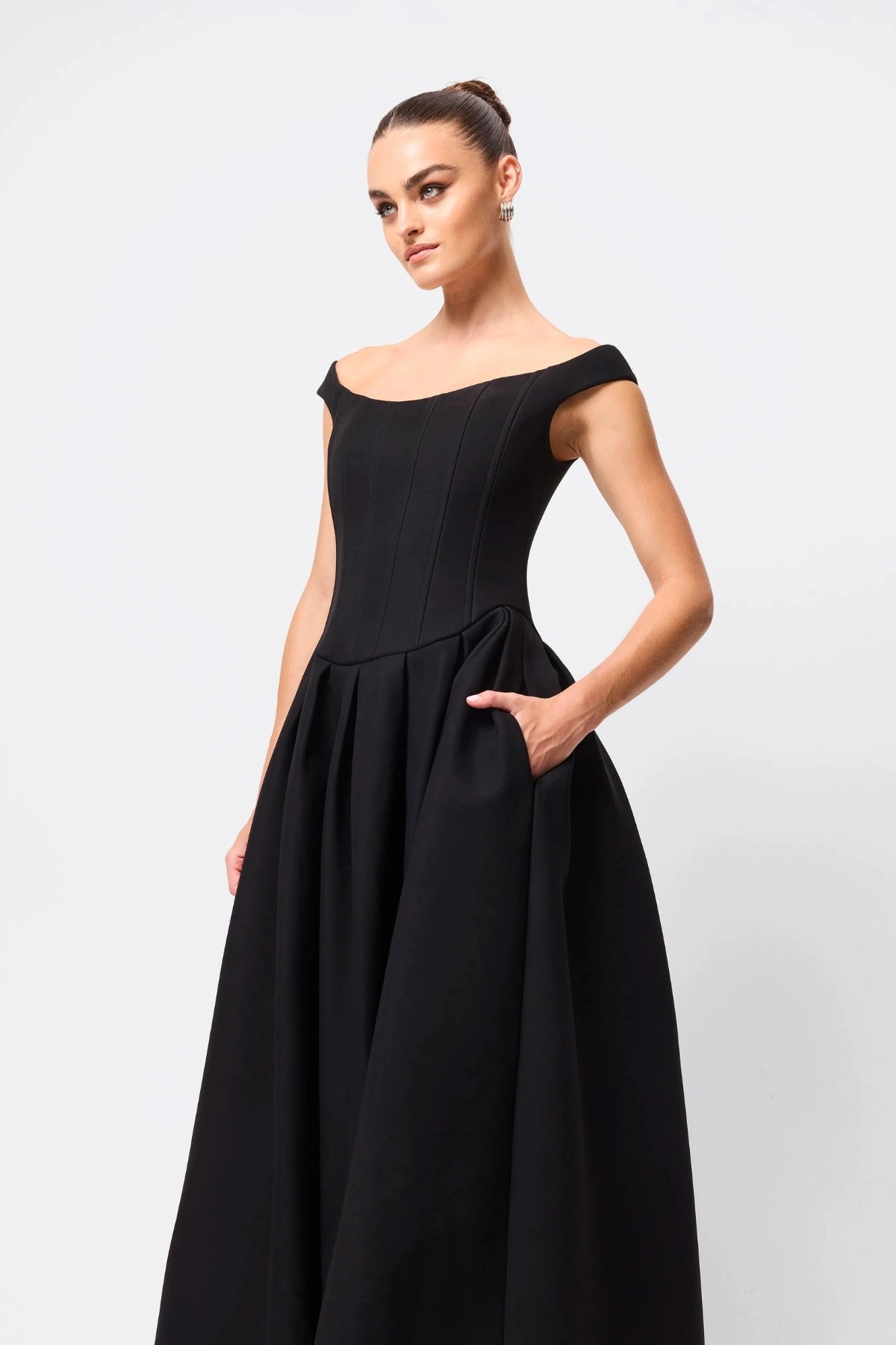 Adoration Maxi Dress Black by Mossman, off-shoulder corset maxi with pleated A-line skirt and pockets, a trendy piece perfect for formal events or evenings.