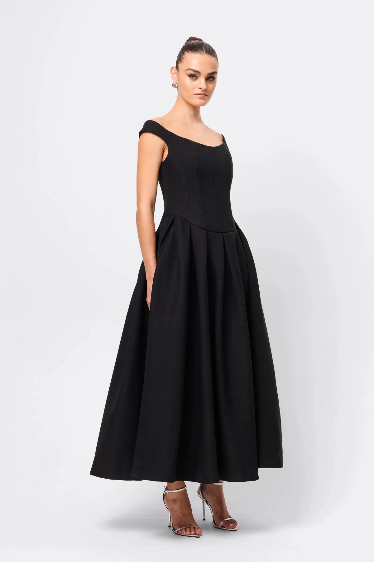 Adoration Maxi Dress Black by Mossman, off-shoulder corset maxi with pleated A-line skirt and pockets, a trendy piece perfect for formal events or evenings.