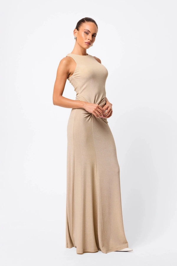 Adore You Maxi Dress by Mossman, a metallic jersey racer maxi with twist waist and fluid skirt that shimmers for weddings or evening events. 