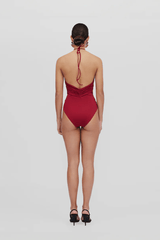 Agapi One Piece Carmesi by Maygel Coronel, halter swimsuit with floral detail and open back. Perfect for beach days or bold swim styling.