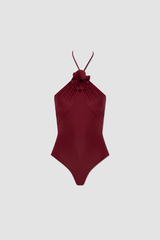 Agapi One Piece Carmesi by Maygel Coronel, halter swimsuit with floral detail and open back. Perfect for beach days or bold swim styling.