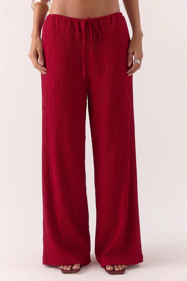 Aine Pants in Raspberry by Sovere – mid-rise crinkle pants with drawstring waist and pockets. Perfect for relaxed, effortless styling.