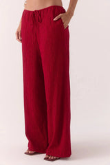 Aine Pants in Raspberry by Sovere – mid-rise crinkle pants with drawstring waist and pockets. Perfect for relaxed, effortless styling.