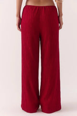 Aine Pants in Raspberry by Sovere – mid-rise crinkle pants with drawstring waist and pockets. Perfect for relaxed, effortless styling.