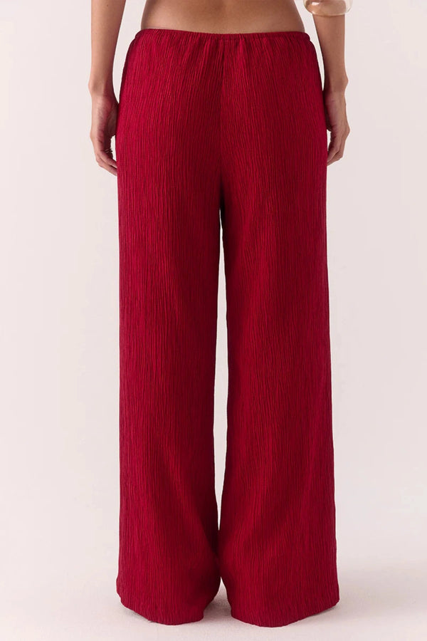 Aine Pants in Raspberry by Sovere – mid-rise crinkle pants with drawstring waist and pockets. Perfect for relaxed, effortless styling.