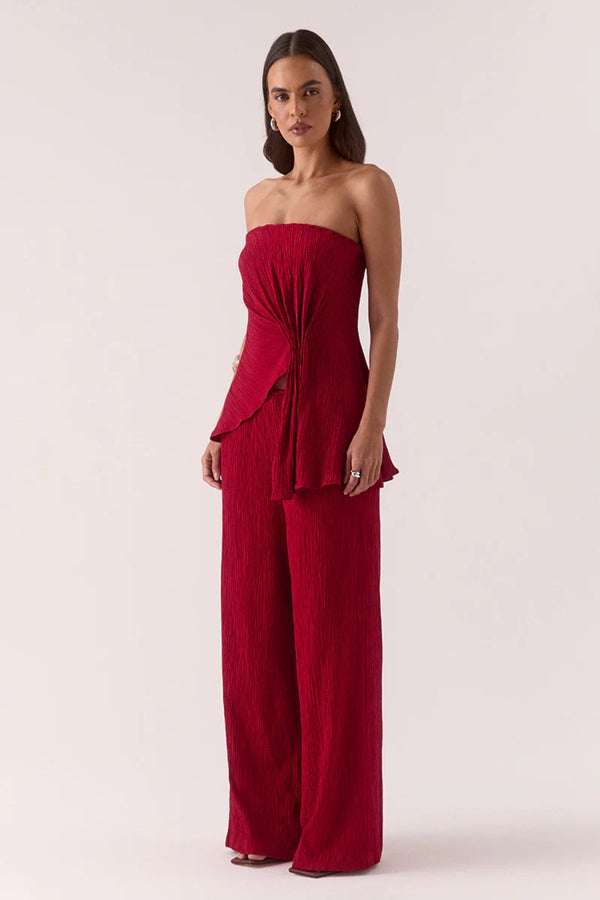Aine Top in Raspberry by Sovere – strapless crinkle top with pleated waist and asymmetric hem. Perfect for bold, warm-weather looks.