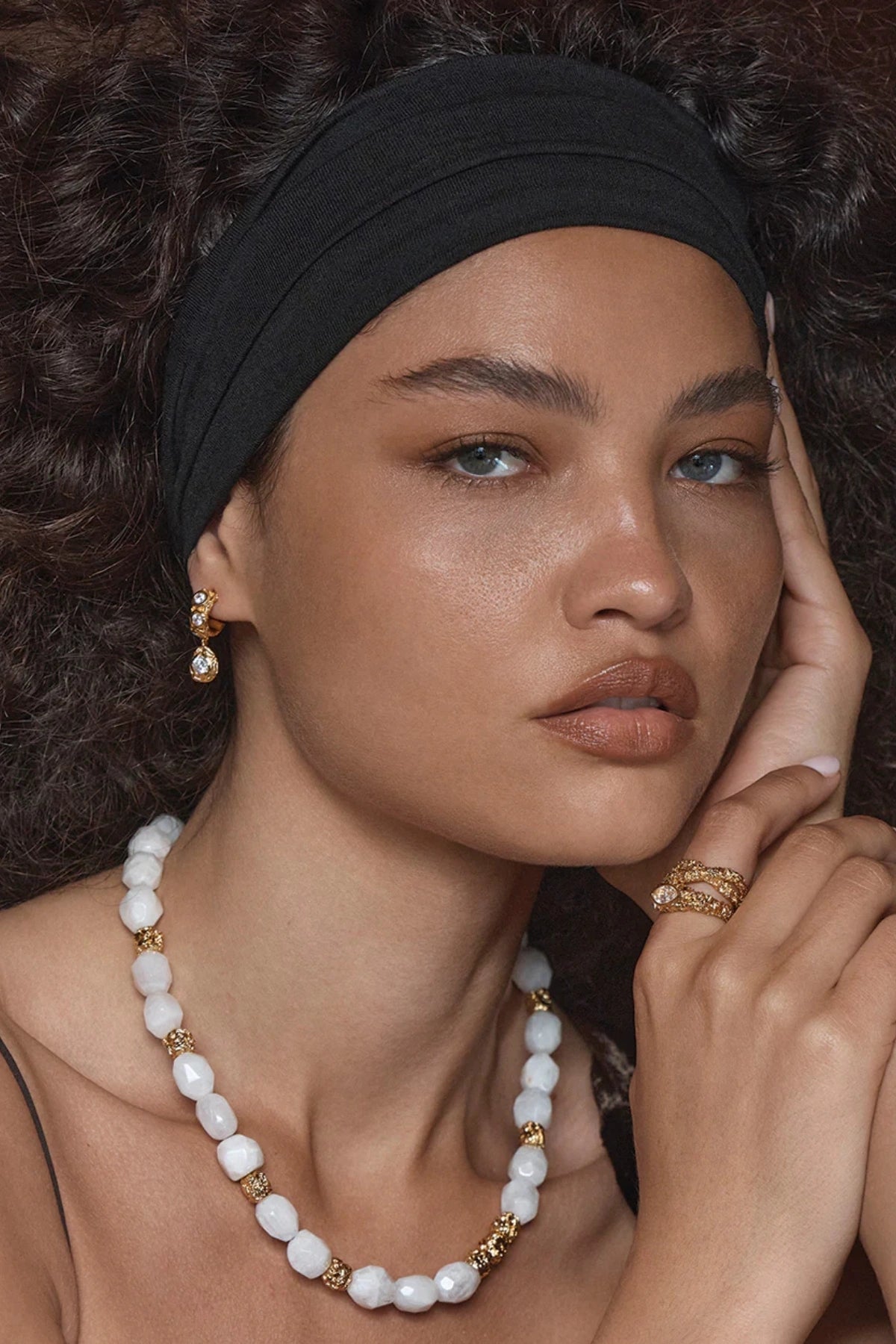 Alanya Earrings Crystal by Amber Sceats, gold-plated hoops with cubic zirconia detail, a trendy piece perfect for chic day wear or elegant evenings.